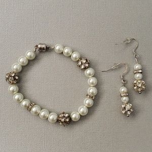 White beaded bracelet and earrings.
